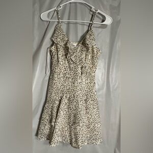 Elegant Cream and Black Ruffle Romper